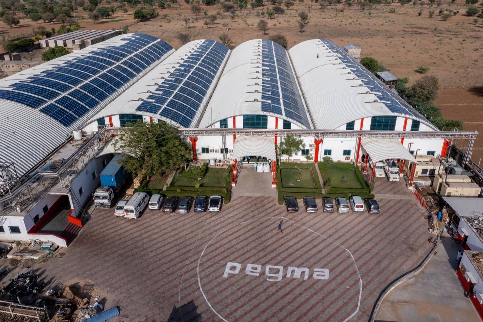 Rooftop solar array covering the arched production halls at the Pegma facility